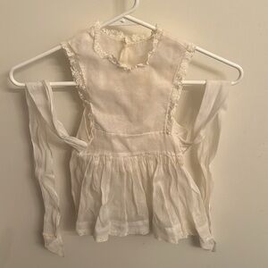 Vintage white sleeveless frilly baby dress with long bow tie ribbon